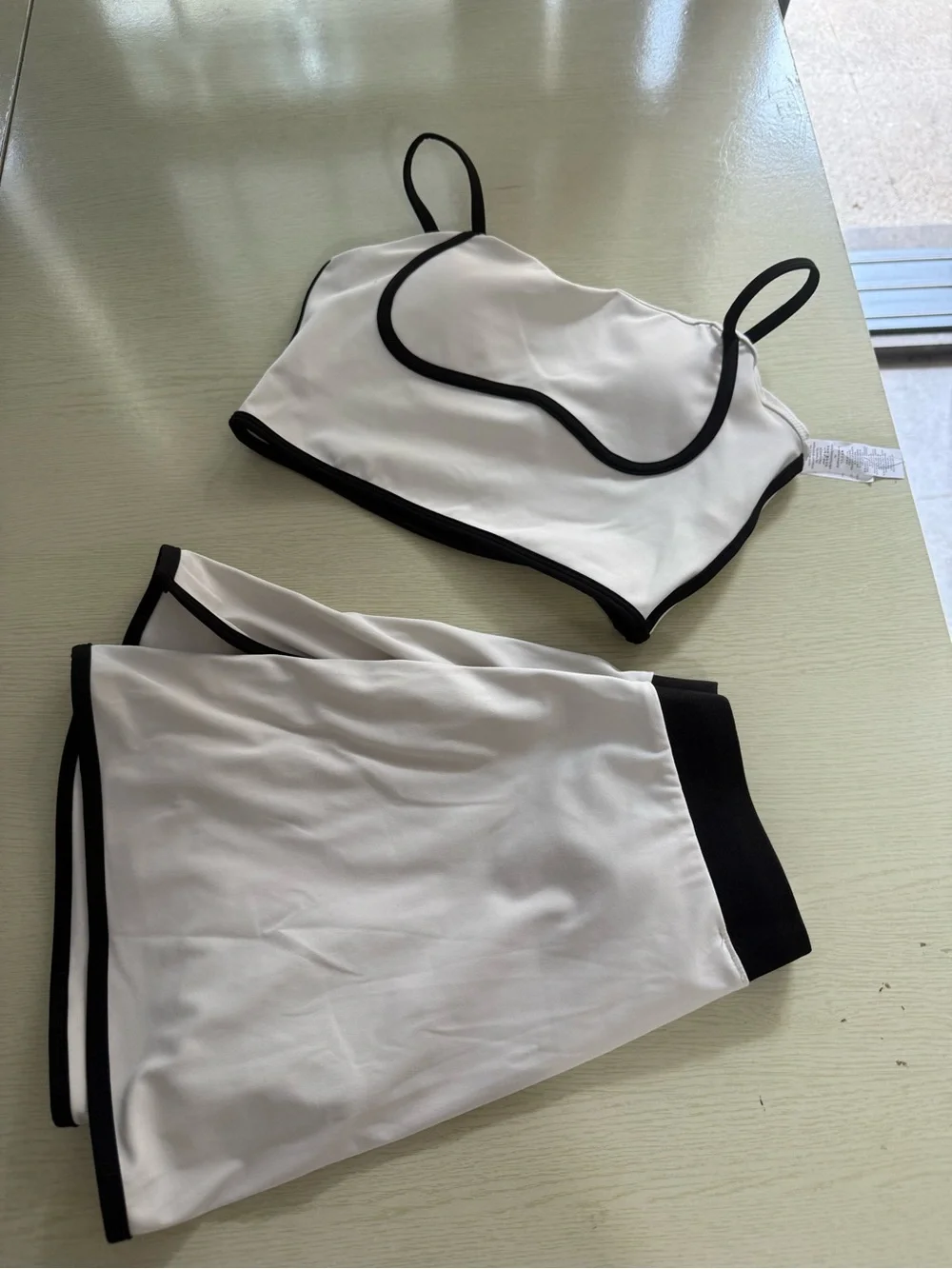 ALO Yoga Cream Sports Bra and Skort with Black Trim - Picture 3 of 6
